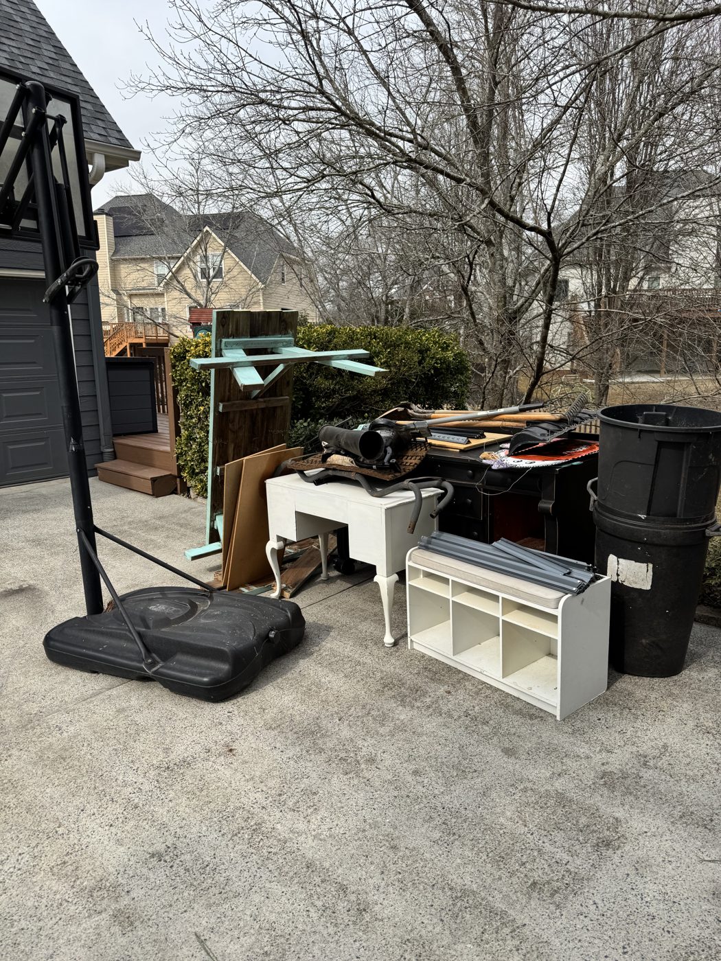 Before junk removal in Alpharetta, GA: driveway cleanout