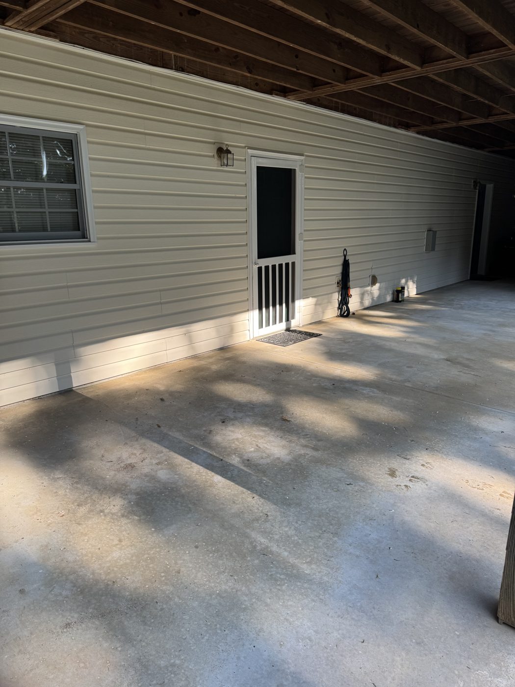 After junk removal in Johns Creek, GA: covered patio cleanout finished